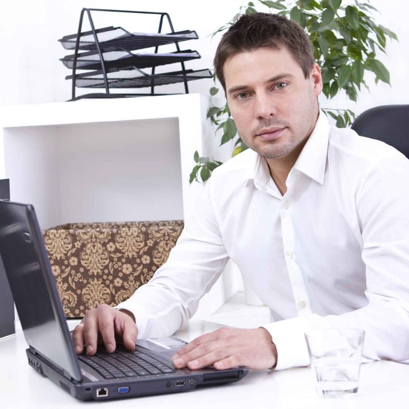 businessman-in-his-office-WRRKEG3-800x800-1